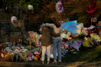 People visit a memorial after deadly shooting at the Covenant School in Nashville