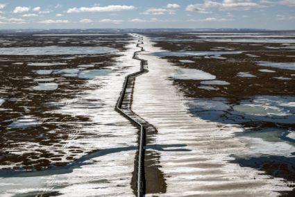 An oil pipeline stretches across the landscape outside Prudhoe Bay in North Slope Borough, Alaska, on May 25, 2019. Photo by Bonnie Jo Mount/The Washington Post via Getty Images