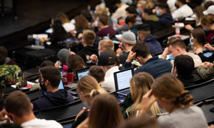 18 October 2021, Lower Saxony, Hanover: Students sit in the mathematics lecture for the first-year students of the Bachelor of Economics in the Audimax at the University of Hanover. For students, professors and lecturers, everyday university life begins again on Monday at many universities in Lower Saxony. Instead of digital and online, most seminars and lectures will once again take place in person. Photo: Julian Stratenschulte/dpa (Photo by Julian Stratenschulte/picture alliance via Getty Images)