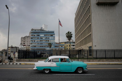 A vintage car passes by the U.S. Embassy in Havana, Cuba, October 30, 2020. Photo by Alexandre Meneghini/Reuters