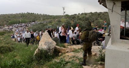 Israeli settlers hold a protest march in West Bank