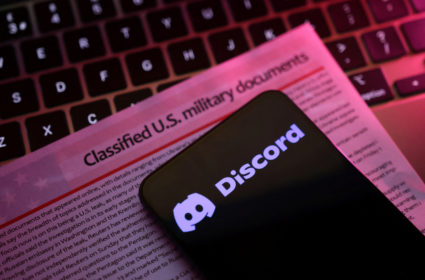 A mockup representation of classified U.S. military documents and the Discord logo are seen in this illustration