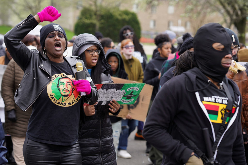 Demonstrators take part in a protest held a day after a grand jury voted against indicting police officers in the fatal sh...