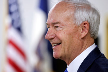 FILE PHOTO: Former Arkansas Governor and Republican presidential candidate Asa Hutchinson greets people in Des Moines