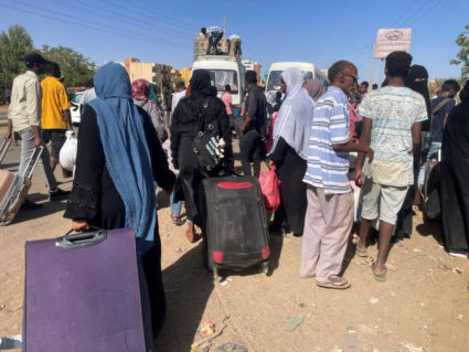 People gather at the station to flee from Khartoum