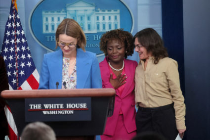 White House Press Secretary Karine Jean-Pierre hugs co-creator of the Showtime's TV show The L Word Ilene Chaiken as cast member Leisha Hailey speaks about LGBTQIA rights to draw attention to Lesbian Visibility Week during a press briefing at the White House in Washington, U.S., April 25, 2023. Photo by Leah Millis/REUTERS