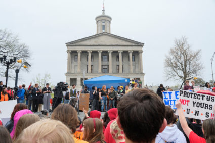 People march to the Tennessee State Capitol during a rally for gun control, in Nashville