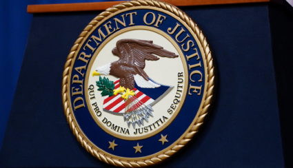 The seal of the U.S. Justice Department is seen on the podium in the Department's headquarters briefing room before a news conference with the Attorney General in Washington, January 24, 2023. Photo by Kevin Lamarque/REUTERS