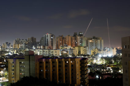 Streaks of lights are seen from Ashkelon as rockets are launched from the Gaza Strip
