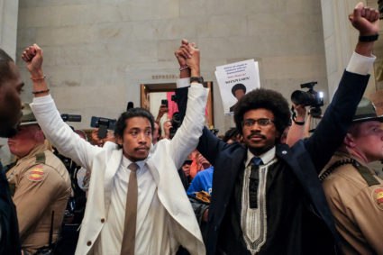 Justin Pearson and Justin Jones raise their hands after being expelled from their seats in Nashville, Tennessee, U.S., April 6, 2023. Photo by Kevin Wurm/REUTERS