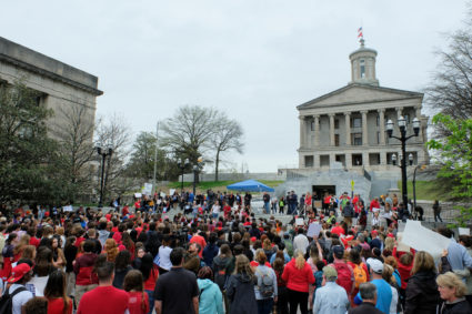 People march to the Tennessee State Capitol during a rally for gun control, in Nashville