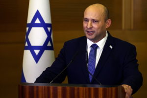 Israeli Prime Minister Naftali Bennett delivers a statement to the media, telling reporters he will not be running in Isra...