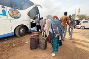 People flee clashes between the paramilitary Rapid Support Forces and the army in Khartoum
