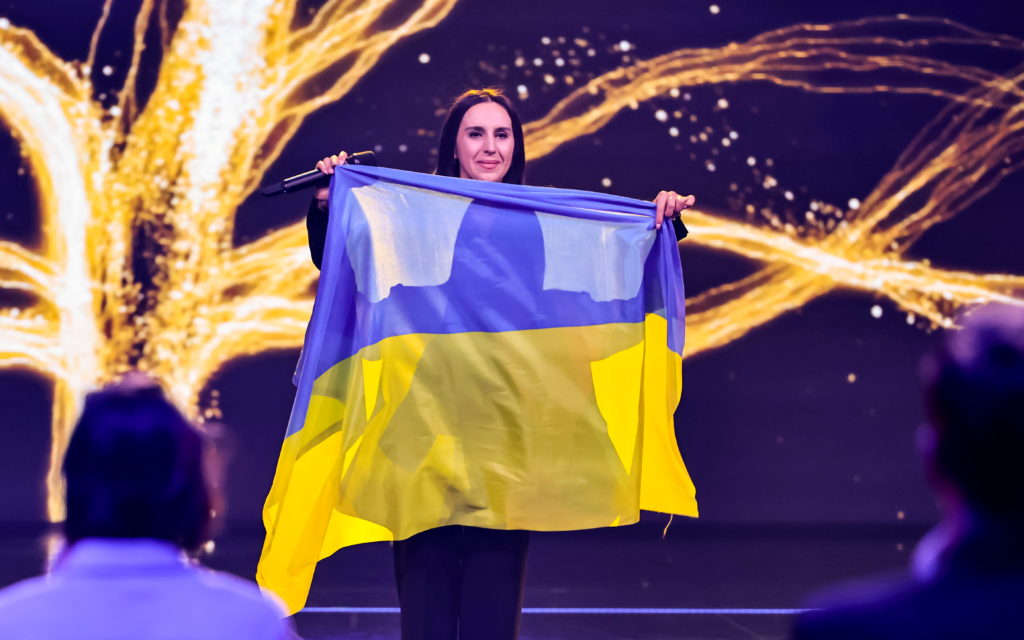 Ukrainian singer Jamala, winner of the Eurovision Song Contest in 2016 and who fled the war in her country, holds a flag a...