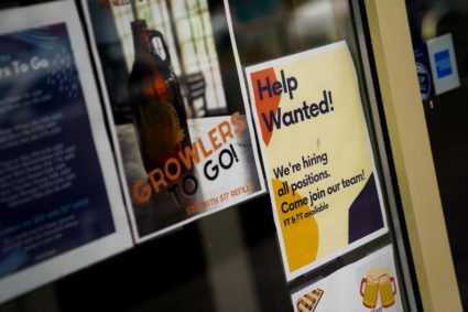An employee hiring sign is seen in a window of a business in Arlington, Virginia, U.S., April 7, 2023. Photo by Elizabeth Frantz/REUTERS