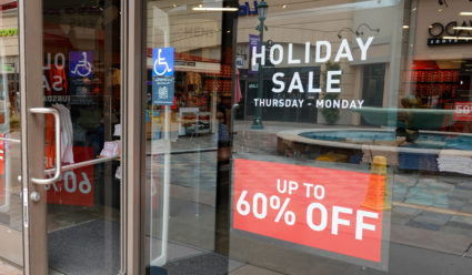 Memorial Day sale signs shown for Memorial Day holiday