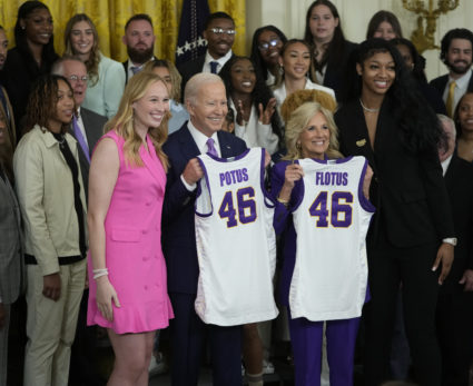 LSU's Angel Reese, right, and Emily Ward, left, present President Joe Biden and First Lady Jill Biden jerseys from Louisiana State University as they visit White House. The President and First Lady welcomed the LSU Tigers women's basketball team to the White House to celebrate their 2022-2023 NCAA Championship seasons at The White House on May 26, 2023. Photo by Jack Gruber-USA TODAY/REUTERS