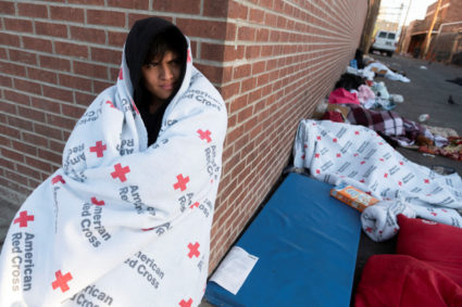 Migrants gather along the U.S. Mexico border near El Paso before the lifting of Tile 42