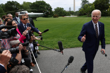 U.S. President Joe Biden speaks to the media after disembarking from Marine One at the White House