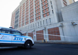 New York City Police (NYPD) car is parked outside the Brooklyn Metropolitan Detention Center, following a bomb threat in t...