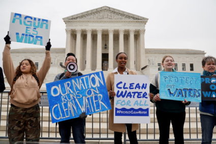 Environmental activists gather outside as the U.S. Supreme Court hears arguments in Sackett vs. EPA in Washington