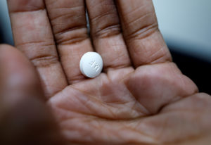 FILE PHOTO: A patient prepares to take Mifepristone, the first medication in a medical abortion, at Alamo Women's Clinic i...