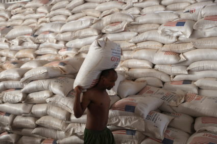 A man carries a sack of wheat at a World Food Program (WFP) warehouse, at a camp for people displaced by drought, in the town of Gode, Somali Region, Ethiopia, April 26, 2022. Photo by Tiksa Negeri/REUTERS