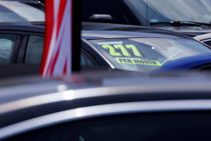 Cars are shown for sale at a car lot in California