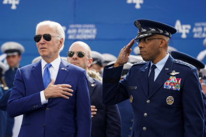 U.S. President Joe Biden puts his hand on his heart during the national anthem, accompanied by Gen. Charles “CQ” Brown, nominated to be the next chairman of the Joint Chiefs of Staff, during the graduation ceremony at the Air Force Academy in Colorado Springs, Colorado, U.S., June 1, 2023. Photo by Kevin Lamarque/REUTERS
