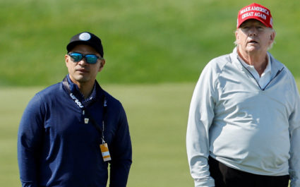 Walt Nauta, personal aide to former U.S. President Trump, walks with Trump at the Trump National Golf Club in Sterling, Vi...