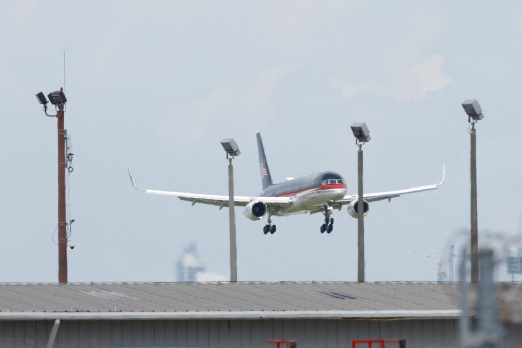 Former U.S. President Donald Trump arrives at Miami International Airport