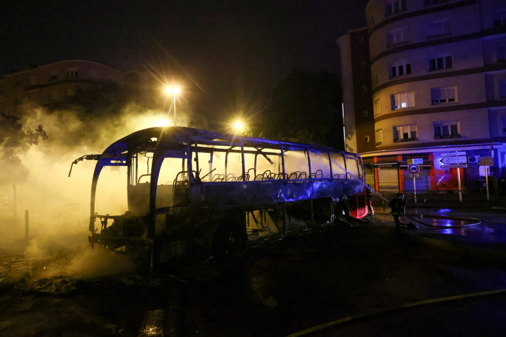 Fourth night of riots after teenager shot dead by police in Paris suburb