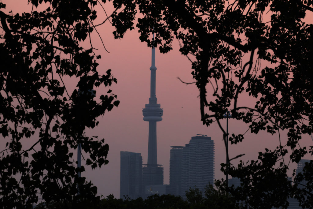 Smoke from forest fires in Northern Ontario and in Quebec contribute to pink hazy sunset in the city from the Cherry Beach