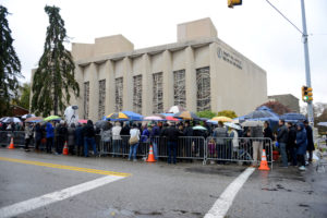 People gathered outside the Tree of Life synagogue in Squirrel Hill to hold a vigil a week after a deadly shooting there