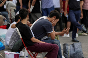 FILE PHOTO: Migrants, survivors of deadly shipwreck, are transferred to Athens from Kalamata