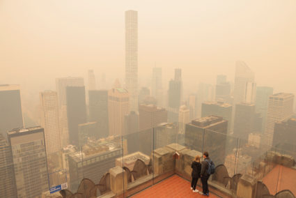 A view from the top of the Rockefeller Center, as haze and smoke caused by wildfires in Canada hang over the Manhattan sky...