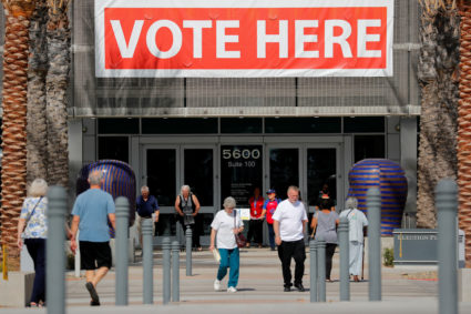 People come and go from the Registrar of Voters office on the final day of voter registration in the upcoming congressiona...