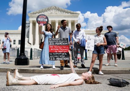 Abortion rights activists and counter protesters protest outside the U.S. Supreme Court, in Washington