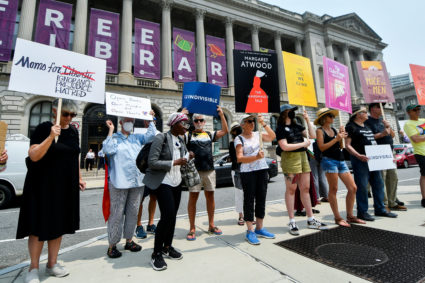 People attend a protest outside the Free Library of Philadelphia