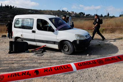 Israeli troops inspect shooting attack scene near Nablus, in the Israeli-occupied West Bank