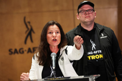SAG-AFTRA union President Fran Drescher speaks next to Duncan Crabtree-Ireland, SAG-AFTRA National Executive Director and Chief Negotiator, at SAG-AFTRA offices after negotiations ended with the Alliance of Motion Picture and Television Producers (AMPTP), the entity that represents major studios and streamers, including Amazon, Apple, Disney, NBCUniversal, Netflix, Paramount, Sony, and Warner Bros Discovery, in Los Angeles, California, U.S., July 13, 2023. Photo by Mike Blake/REUTERS