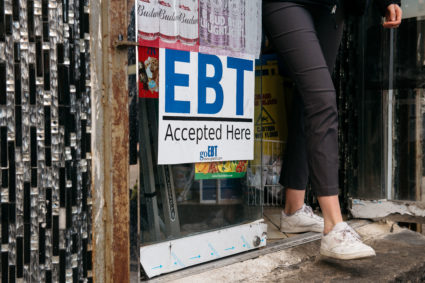 A sign alerting customers about SNAP food stamps benefits is displayed at a Brooklyn grocery store on December 5, 2019 in New York City. Photo by Scott Heins/Getty Images
