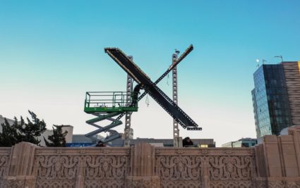 Twitter X sign is being installed at the Twitter Headquarters