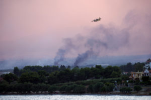 Ammunition depot explodes as a wildfire burns in Nea Aghialos