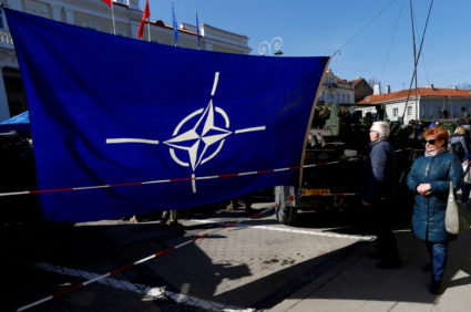 FILE PHOTO: NATO flag is seen at the military equipment display during the celebration of the 15th anniversary of Lithuani...
