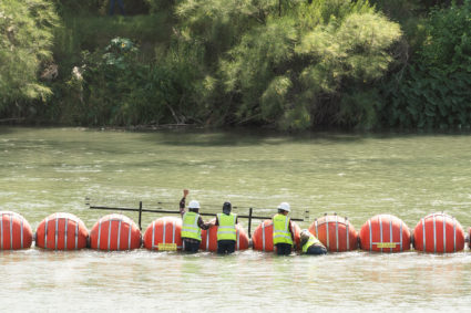 Buoys float in the Rio Grande in Eagle Pass