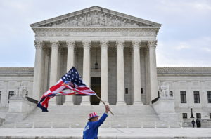 Supporters of those arrested in the January 6, 2021 attack on the U.S. Capitol protest between the U.S. Supreme Court and ...