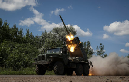 Ukrainian servicemen fire a BM-21 Grad multiple launch rocket system towards Russian troops in Donetsk region