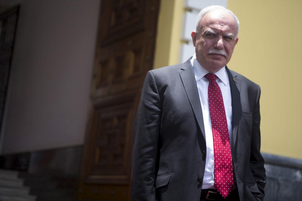 Palestinian Foreign Minister Riad al-Malki leaves the Venezuelan Foreign Ministry building after his meeting with his Vene...