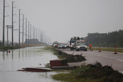Crews clear debris from Highway 23 during Hurricane Barry in Plaquemines Parish, Louisiana, U.S. July 14, 2019. Photo by Jonathan Bachman/REUTERS